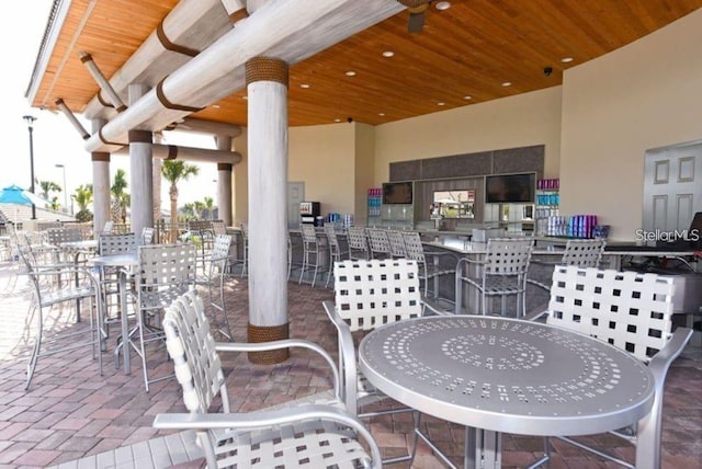 view of patio / terrace featuring outdoor dry bar