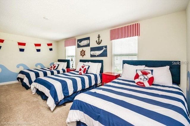 carpeted bedroom featuring baseboards and lofted ceiling