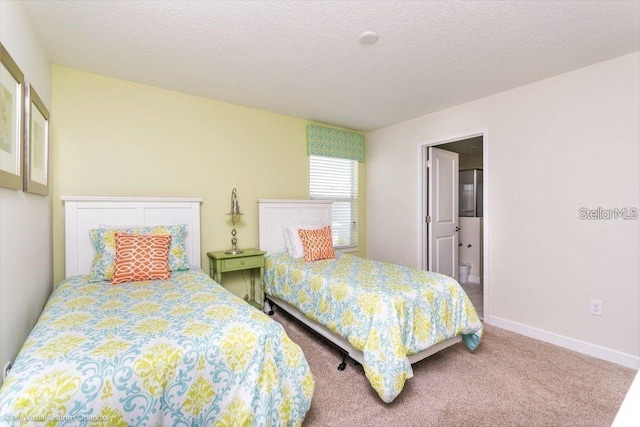 bedroom with carpet flooring, a textured ceiling, and baseboards