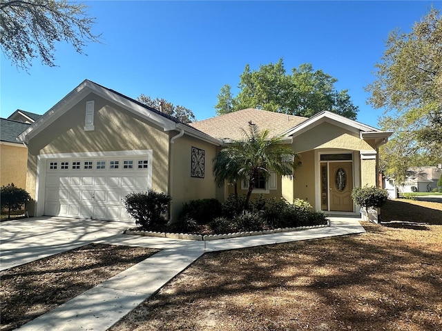 ranch-style house featuring stucco siding, concrete driveway, and a garage