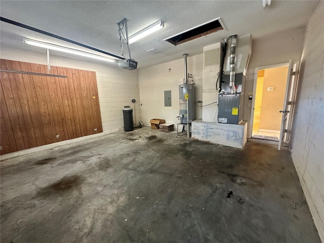 garage with electric panel, gas water heater, heating unit, and a garage door opener