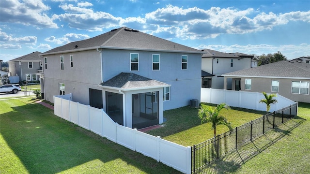 rear view of property with central air condition unit, a yard, a fenced backyard, and stucco siding