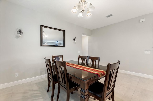 dining area featuring light tile patterned flooring, visible vents, baseboards, and an inviting chandelier