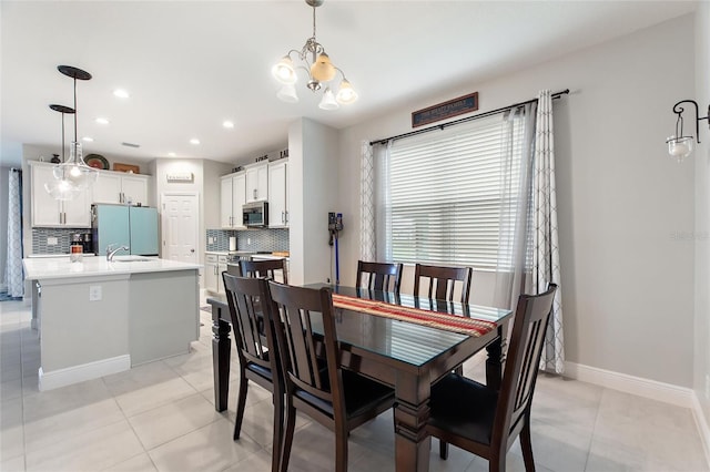 dining room featuring a notable chandelier, recessed lighting, baseboards, and light tile patterned floors