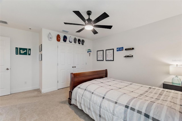 bedroom with ceiling fan, baseboards, visible vents, and light carpet