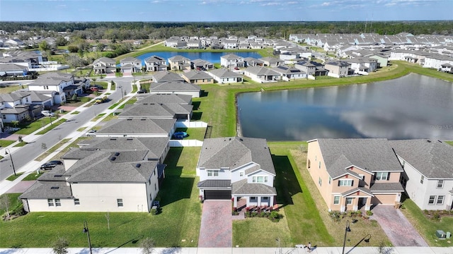 bird's eye view featuring a residential view and a water view