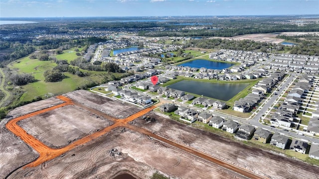 bird's eye view featuring a residential view and a water view