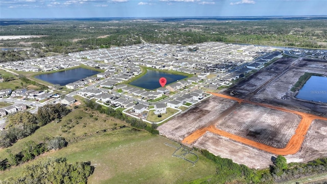 aerial view with a residential view and a water view