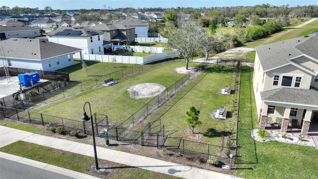 birds eye view of property with a residential view