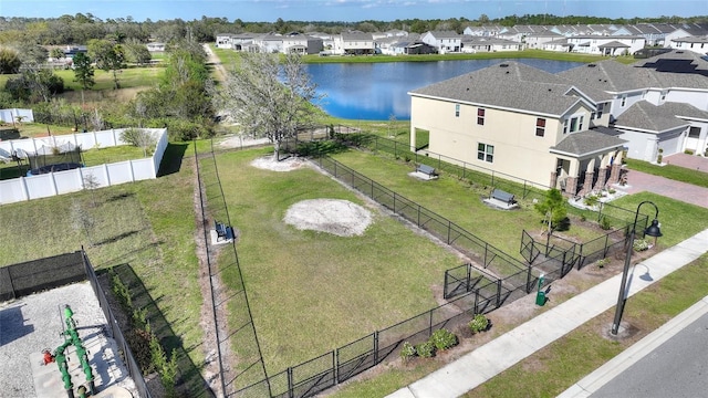 birds eye view of property with a residential view and a water view