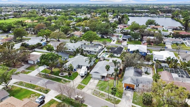 bird's eye view with a residential view and a water view