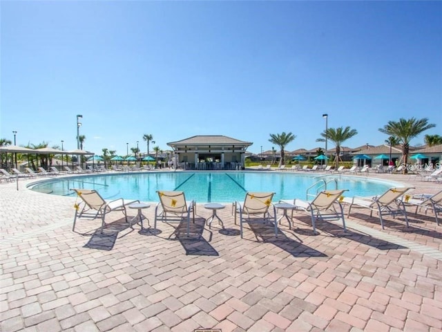 community pool with a patio area