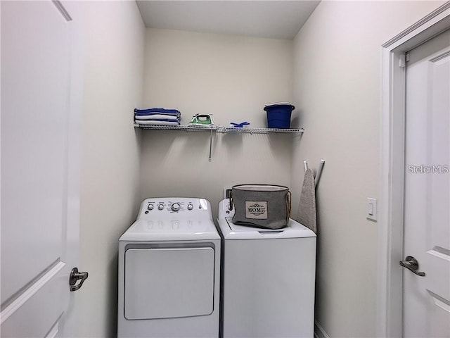 laundry room with washing machine and dryer and laundry area