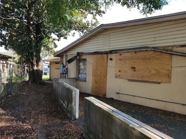 view of side of property with fence