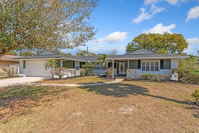 single story home featuring an attached garage, concrete driveway, and a front yard