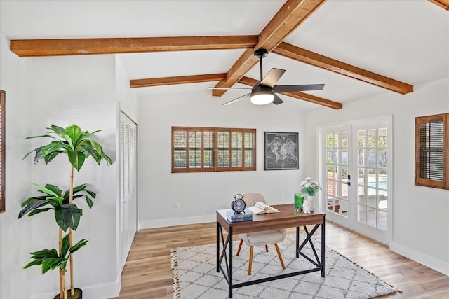 office area featuring vaulted ceiling with beams, baseboards, light wood-style floors, and a ceiling fan