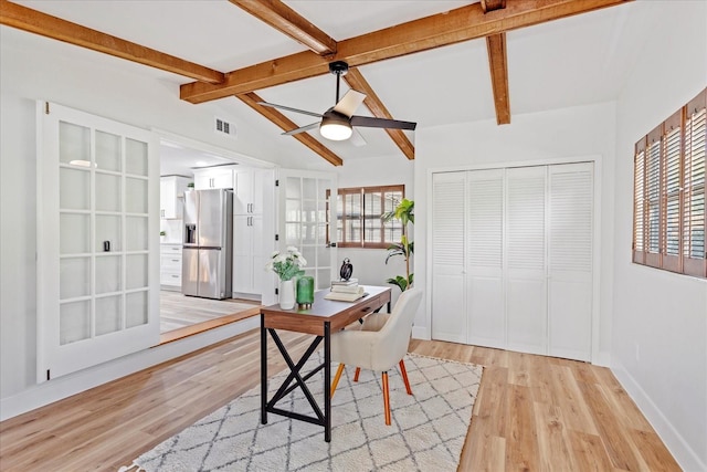 office area featuring visible vents, lofted ceiling with beams, light wood finished floors, baseboards, and ceiling fan