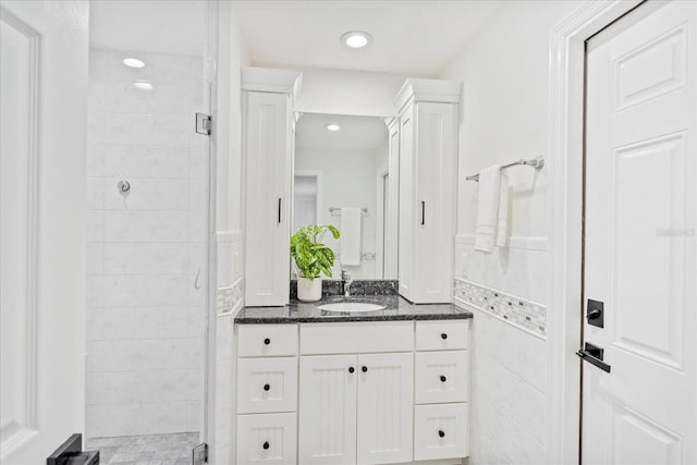 full bath featuring recessed lighting, a stall shower, and vanity