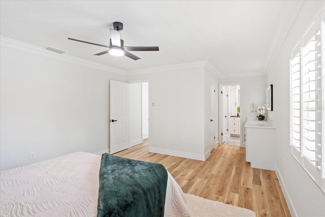 bedroom featuring a ceiling fan, visible vents, baseboards, crown molding, and light wood-type flooring