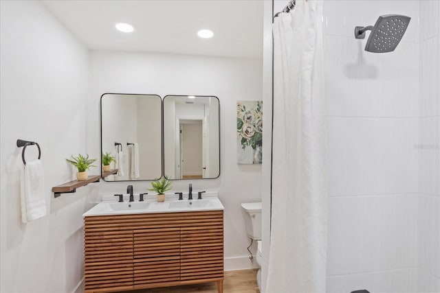 bathroom featuring recessed lighting, baseboards, a shower with curtain, and a sink