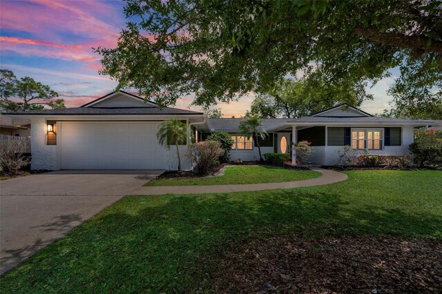 116 E Cottesmore Cir, Longwood, FL 32779 - single story home with concrete driveway, an attached garage, and a yard