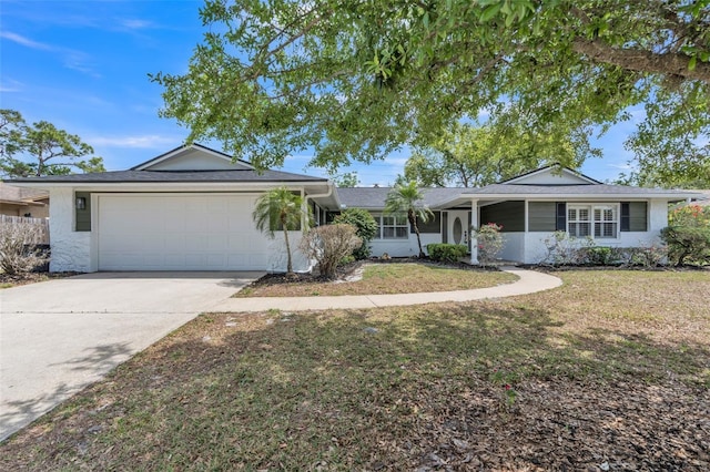 116 E Cottesmore Cir, Longwood, FL 32779 - ranch-style house with an attached garage, concrete driveway, and a front yard