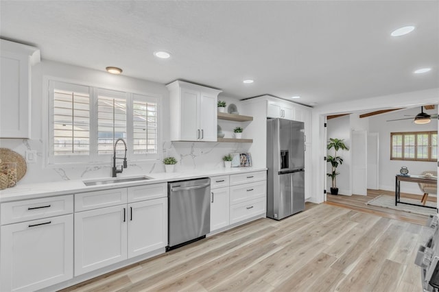 116 E Cottesmore Cir, Longwood, FL 32779 - kitchen with a wealth of natural light, a sink, open shelves, and appliances with stainless steel finishes