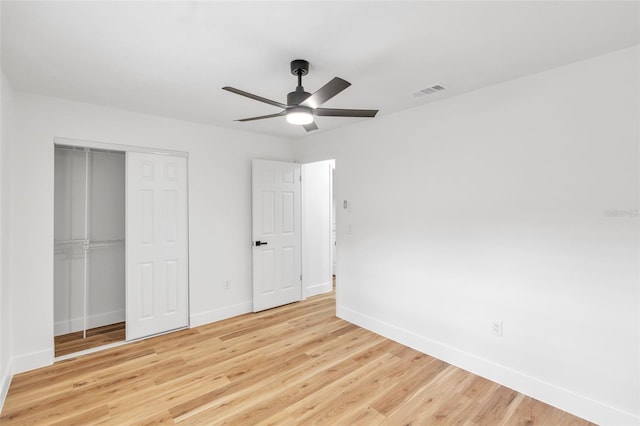 116 E Cottesmore Cir, Longwood, FL 32779 - unfurnished bedroom featuring a closet, a ceiling fan, wood finished floors, baseboards, and visible vents