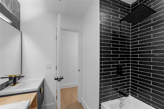 607 Dunblane Dr, Winter Park, FL 32792 - full bath with vanity, shower / bathing tub combination, baseboards, and wood finished floors