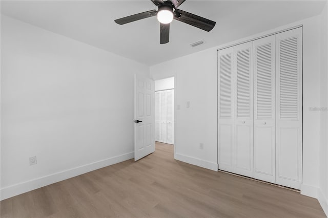 607 Dunblane Dr, Winter Park, FL 32792 - unfurnished bedroom featuring visible vents, baseboards, light wood-type flooring, a closet, and a ceiling fan