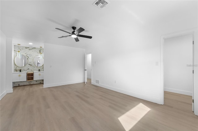 607 Dunblane Dr, Winter Park, FL 32792 - unfurnished living room with visible vents, light wood-style flooring, baseboards, and ceiling fan