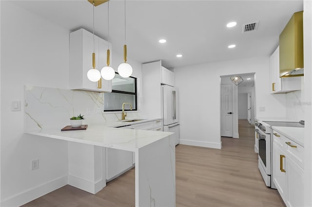 607 Dunblane Dr, Winter Park, FL 32792 - kitchen with a sink, white appliances, a peninsula, and white cabinets