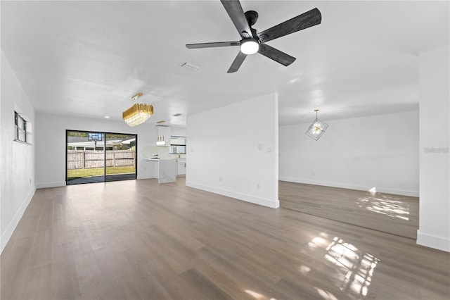 607 Dunblane Dr, Winter Park, FL 32792 - unfurnished living room featuring light wood-type flooring, baseboards, visible vents, and ceiling fan