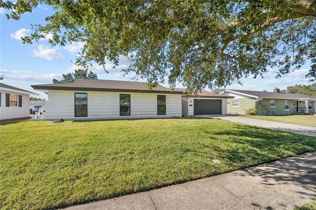 607 Dunblane Dr, Winter Park, FL 32792 - ranch-style house featuring a garage, a front yard, and driveway