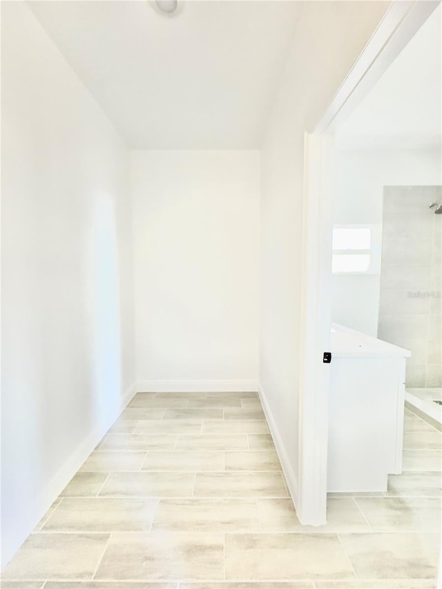 interior space featuring wood finish floors and baseboards