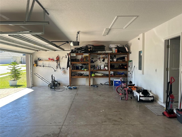 garage featuring electric panel and a garage door opener