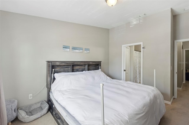 bedroom featuring light carpet, visible vents, and baseboards