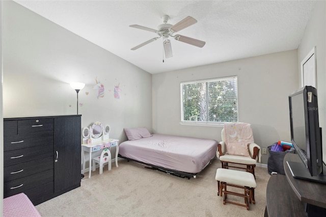 bedroom featuring baseboards, ceiling fan, and carpet floors