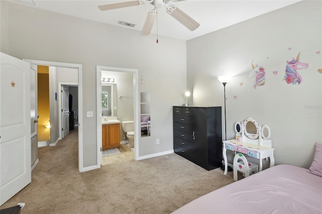 bedroom featuring baseboards, visible vents, ceiling fan, light colored carpet, and connected bathroom