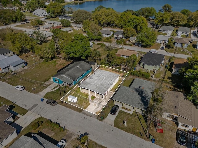 birds eye view of property with a residential view and a water view