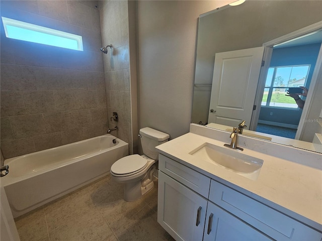 full bath featuring a wealth of natural light, toilet, shower / washtub combination, and vanity