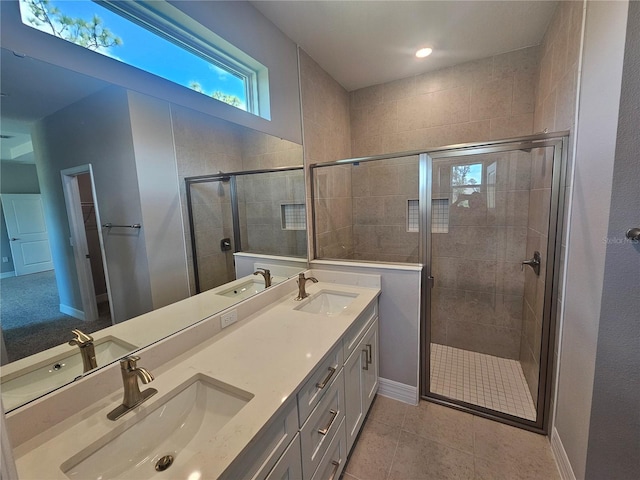 bathroom featuring a shower stall and a sink