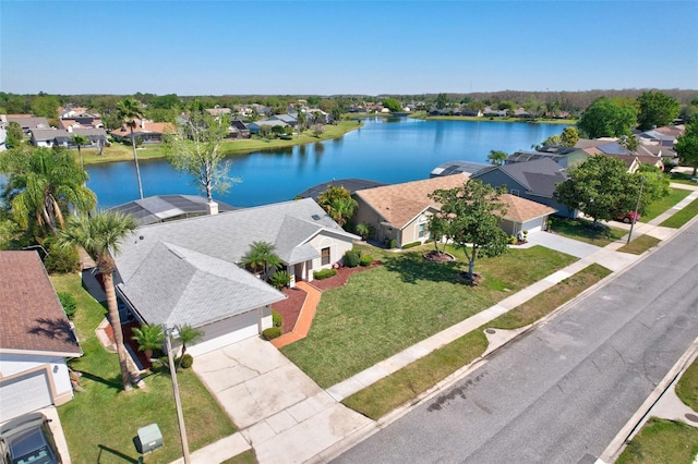 bird's eye view featuring a residential view and a water view