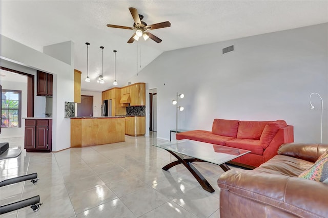 living room featuring visible vents, high vaulted ceiling, light tile patterned flooring, and a ceiling fan