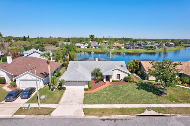 bird's eye view featuring a residential view and a water view