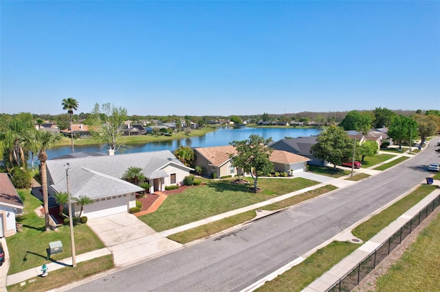 bird's eye view with a residential view and a water view