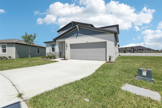 view of front of property with an attached garage, a front lawn, concrete driveway, and fence