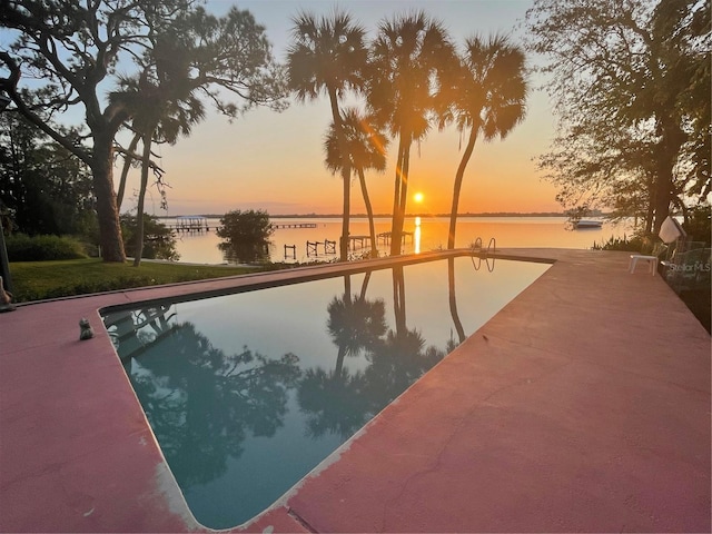 view of pool featuring a water view