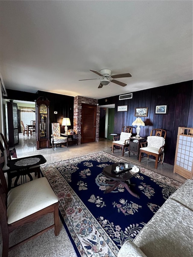 living area featuring ceiling fan