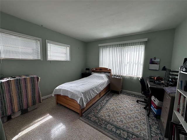 bedroom featuring baseboards